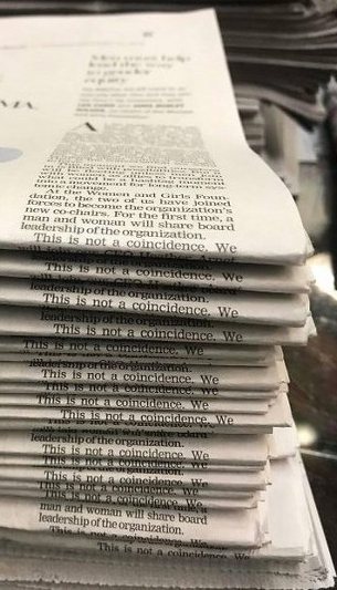 coincidental newspaper stacking